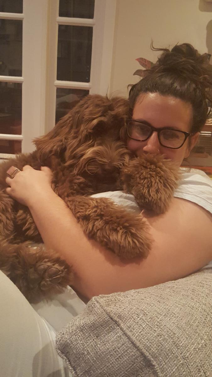 Alisa hugging puppy
