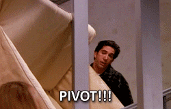 Ross from Friends carrying a couch around a corner and shouting, 