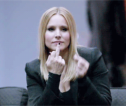 Gif from Veronica Mars of Kristen Bell giving the middle finger and then pretending her middle finger is lipstick.