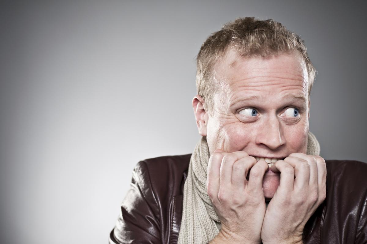 man biting his nails