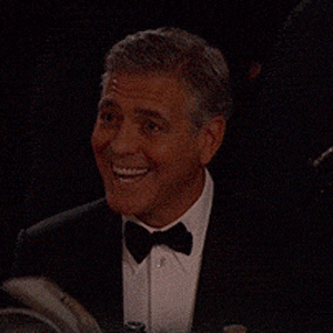 Gif of George Clooney flipping through a book.